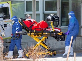 Ambulance attendants transport a resident from Centre d'hebergement de Sainte-Dorothe, a seniors' long-term care centre, amid the outbreak of the coronavirus disease (COVID-19), in Laval, Quebec, Canada April 16, 2020.