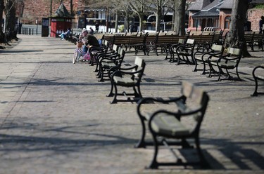 A man sits on a bench, as the spread of the coronavirus disease (COVID-19) continues, Chester, Britain, April 8, 2020. REUTERS/Molly Darlington ORG XMIT: AI
