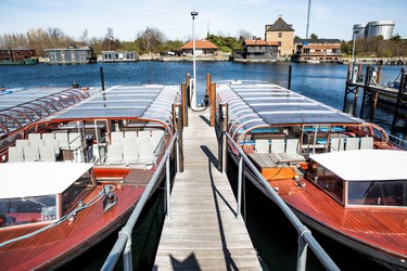 The boats of the Sightseeing company 'Stromma Canal Tours Copenhagen' lie at the quay in Copenhagen Harbour during the government lockdown to prevent the coronavirus disease (COVID-19), Denmark April 8, 2020. Ritzau Scanpix/via REUTERS    ATTENTION EDITORS - THIS IMAGE WAS PROVIDED BY A THIRD PARTY. DENMARK OUT. NO COMMERCIAL OR EDITORIAL SALES IN DENMARK. ORG XMIT: DNM005