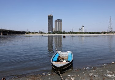 A boat is seen on the banks of the river Yamuna after air pollution level started to drop during a 21-day nationwide lockdown to slow the spreading of Coronavirus disease (COVID-19), in New Delhi, India, April 8, 2020. REUTERS/Adnan Abidi ORG XMIT: PPP-DEL20