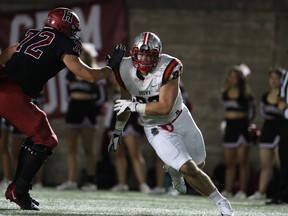 Brown University's Michael Hoecht takes on an offensive lineman.