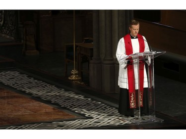 Roman Catholic Cardinal Thomas Colllins presides over Good Friday mass at St. Michael's Cathedral Basilica on Bond St. To and empty church on Good Friday on Friday April 10, 2020. Jack Boland/Toronto Sun/Postmedia Network