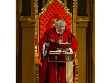 Roman Catholic Cardinal Thomas Colllins presides over Good Friday mass at St. Michael's Cathedral Basilica on Bond St. To and empty church on Good Friday on Friday April 10, 2020. Jack Boland/Toronto Sun/Postmedia Network