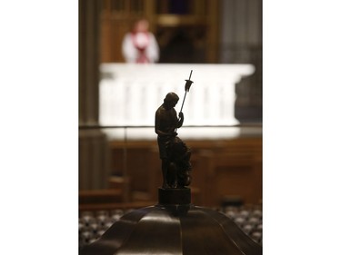 Roman Catholic Cardinal Thomas Colllins presides over Good Friday mass at St. Michael's Cathedral Basilica on Bond St. To and empty church on Good Friday on Friday April 10, 2020. Jack Boland/Toronto Sun/Postmedia Network