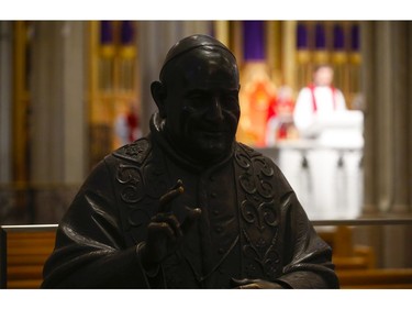 Roman Catholic Cardinal Thomas Colllins presides over Good Friday mass at St. Michael's Cathedral Basilica on Bond St. To and empty church on Good Friday on Friday April 10, 2020. Jack Boland/Toronto Sun/Postmedia Network