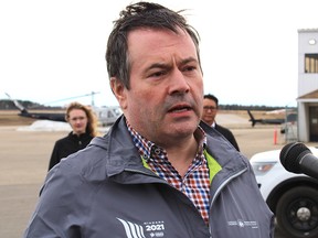 Alberta Premier Jason Kenney speaks to media outside the Executive Flight Centre in Fort McMurray, Alta., on Monday, April 27, 2020.