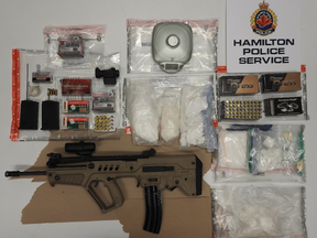 Hamilton police have arrested a husband and wife caught with two assault rifles and $1 million in street drugs. SUPPLIED/HAMILTON POLICE