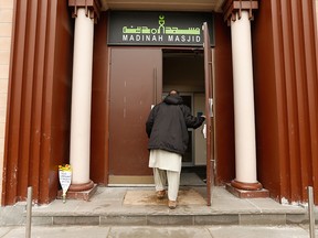 A member of the Madinah Masjid mosque arrives for Jumu'ah prayer service on Danforth Ave. in this March 15, 2019, file photo.