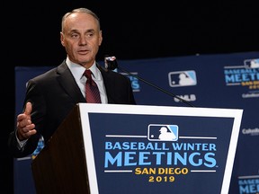 MLB commissioner Rob Manfred speaks to the media team during the MLB Winter Meetings at Manchester Grand Hyatt.