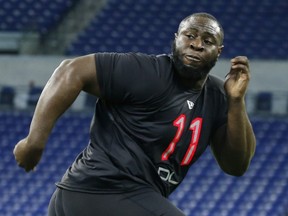 Oklahoma defensive lineman Neville Gallimore goes through a workout drill during the 2020 NFL Combine at Lucas Oil Stadium in Indianapolis on Feb. 29, 2020.