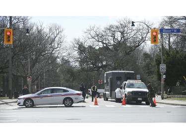 Toronto Police mounted unit and Toronto by-law enforcement officers were at the Bloor St. West entrance  High Park making sure about social distancing and telling people to move along and not gather in areas.  on Sunday April 5, 2020. Jack Boland/Toronto Sun/Postmedia Network