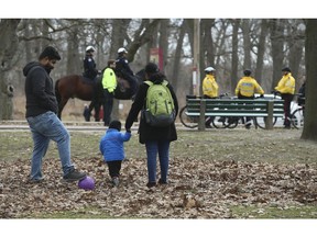 Toronto Police mounted unit and Toronto by-law enforcement officers in High Park enforcing social distancing rules on Sunday April 5, 2020.