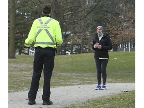 Toronto Police and bylaw enforcement officers at the Bloor St. W. entrance to High Park making sure about social distancing on April 5, 2020.