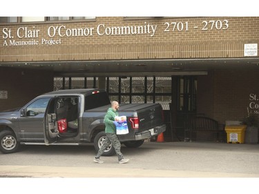 A man drops of supplies to the St. Clair OÕConnor Community long-term care home in East York. It has been reported that  four resident of the facility have died and another 14 have COVID-19 symptoms.  on Sunday April 5, 2020. Jack Boland/Toronto Sun/Postmedia Network