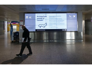 Pearson International airport was practically vacant at Terminal 1  except for a few international flyers  on Thursday April 2, 2020. Jack Boland/Toronto Sun/Postmedia Network