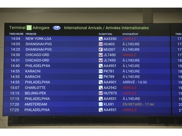 Pearson International airport was practically vacant at Terminal 1 and the board shows flights with a lot still arriving - yet adminstrators said they were coming yet just still booked  on Thursday April 2, 2020. Jack Boland/Toronto Sun/Postmedia Network