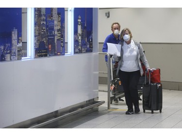 ( CORRECTION 9 snowboarding to snowbirds ) Lynne Downey and her husband Pat - of Whitby - are snowbirds who came back from winter in Puerto Rico with two other people on their flight at Terminal 1. They were handed information sheets. They were under curfew in Puerto Rico from 7 p.m. to 5 a.m. for the past two weeks and now go to quarantine for 14 days on Thursday April 2, 2020. Jack Boland/Toronto Sun/Postmedia Network