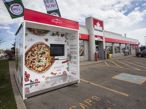 PizzaForno, an automated pizza vending machine sits at the truck stop at Petro Canada Dixie Petro-Pass  in Mississauga, Ont. on Monday April 27, 2020. There are seven different pizzas to choose from, and can be ready in three minutes with no human interaction. Ernest Doroszuk/Toronto Sun/Postmedia