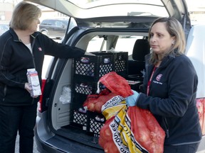 Volunteers at the Salvation Army Mississauga Temple distribute food donations that are desperately needed during COVID-19 crisis on Wednesday, April 1, 2020. (Veronica Henri/Toronto Sun/Postmedia Network)