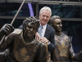Former Maple Leafs captain Darryl Sittler with his bronzed statue on Legends Row in front of Scotiabank Arena. Sittler, a veteran of many such series, figures three-game playoff sets might be the way to go if the NHL is able to complete its current season. (Craig Robertson/Toronto Sun)