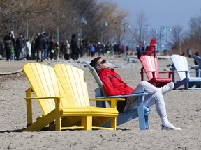 Torontonians enjoy a sunny afternoon in the Beach despite government calls for social distancing. (Stan Behal/Toronto Sun)
