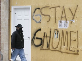 Masks, signs and boarded up stores continue during COVID-19 in Toronto on Wednesday, April 15, 2020.