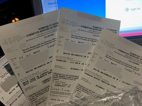 A York Regional Police officer holds up seized cannabis and the numerous tickets handed out to a man, 20, nabbed driving 69 km/h over the posted speed limit in Vaughan on Monday. The same man was caught driving 68 km/h over the posted speed limit in February.