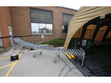 Toronto Daily Bread Food Bank on New Toronto St. in Etobicoke has set up an inflatable medical tent outside its facility along with a conveyor belt to get food to its clients since they cannot come in the building  on Wednesday April 8, 2020. Jack Boland/Toronto Sun/Postmedia Network