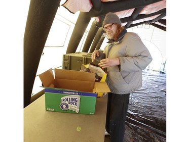 Steven who uses the Toronto Daily Bread Food Bank on New Toronto St. in Etobicoke thinks their set ups for COVID is great. The TDBFB has set up an inflatable medical tent outside its facility along with a conveyor belt to get food to its clients since they cannot come in the building  on Wednesday April 8, 2020. Jack Boland/Toronto Sun/Postmedia Network