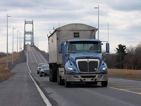 A truck drives over the Seaway International Bridge from the U.S. into Canada after movement restrictions came into effect due to coronavirus disease (COVID-19) on Cornwall Island, Ont., on March 25, 2020.