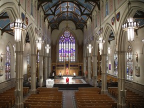 Roman Catholic Cardinal Thomas Colllins presides over Good Friday mass at St. Michael's Cathedral Basilica on Bond St. To and empty church on Good Friday on Friday April 10, 2020. Jack Boland/Toronto Sun/Postmedia Network