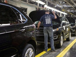 Ford Edges sit on a production line as Ford Motor Company celebrates the global production start of the 2015 Ford Edge at the Ford Assembly Plant in Oakville, Ont., on Thursday, February 26, 2015.