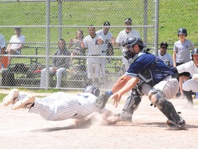 Toronto Maple Leafs catcher Justin Marra tries to tag out a London Majors base-runner during an IBL game last season at Christie Pits. MAX LEWIS PHOTO