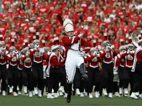 A drum major leads the Wisconsin Badgers band onto the field before a game against the Arizona State Sun Devils in 2010. Around that time, Kraig Appleton was playing for Wisconsin. He's reportedly been charged with murder.
