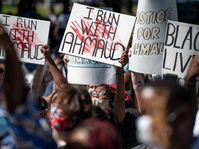 Demonstrators protest the shooting death of Ahmaud Arbery at the Glynn County Courthouse on May 8, 2020 in Brunswick, Ga.