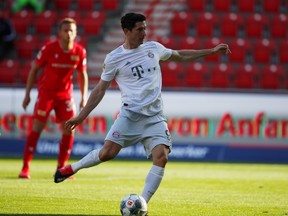 Robert Lewandowski of Bayern Munich scores their first goal from the penalty spot, during the Bundesliga match against FC Union Berlin at Stadion An der Alten Foersterei on May 17, 2020 in Berlin, Germany. The Bundesliga and Second Bundesliga is the first professional league to resume the season after the nationwide lockdown due to the ongoing Coronavirus (COVID-19) pandemic. All matches until the end of the season will be played behind closed doors.