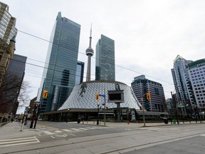 The CN Tower looms behind Roy Thompson Hall on April 23 2020.