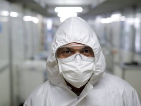 Healthcare worker Vagner da Costa wearing a protective face mask poses for a picture at a field hospital set up to treat patients suffering from COVID-19 in Guarulhos, Sao Paulo state, Brazil, on May 12, 2020.