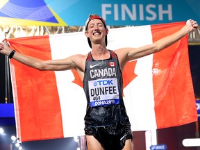 Canadian race walker Evan Dunfee celebrates finishing third in the Men’s 50km Race Walk final during day two of 17th IAAF World Athletics Championships Doha 2019.
