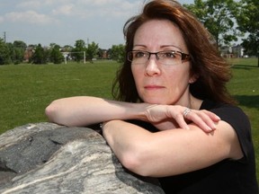Kim Hancox sits at Bill Hancox park in Pickering on June 21, 2012. Her husband, Bill, was stabbed to death while working undercover at a Scarborough strip mall.