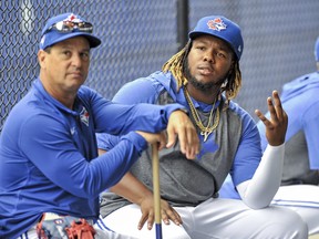 Blue Jays manager Charlie Montoyo (left) and Vladimir Guerrero Jr. may get a chance to return if the owners and players can reach a deal.