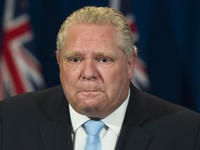 Ontario Premier Doug Ford fights back tears as he answers question about a disturbing report from the Canadian military regarding five Ontario long-term-care homes during his daily updates regarding COVID-19 at Queen's Park in Toronto on Tuesday, May 26, 2020. THE CANADIAN PRESS/Nathan Denette