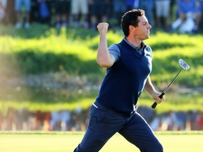 Rory McIlroy of Europe reacts on the 16th green after making a putt to win the match during afternoon fourball matches of the 2016 Ryder Cup at Hazeltine National Golf Club on September 30, 2016 in Chaska, Minnesota.  McIlroy says Ryder Cups are much better with fans in attendance.