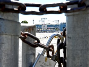 The gates are chained and locked at Dodger Stadium on March 26. Opening day between the San Francisco Giants and Los Angeles Dodgers was canceled due to the coronavirus pandemic.