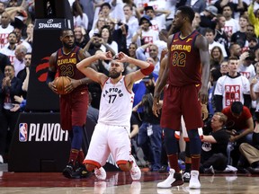 Jonas Valanciunas of the Toronto Raptors falls to his knees after missing a number of shot attempts late in a playoff game against Cleveland. Toronto's repeated failures against the Cavaliers and LeBron James resulted in significant changes.