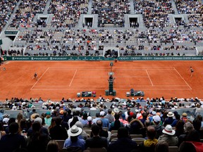 In this file photo taken on June 8, 2019, Czech Republic's Marketa Vondrousova, left, returns the ball to Australia's Ashleigh Barty during their women's singles final match on day fourteen of The Roland Garros 2019 French Open tennis tournament in Paris.