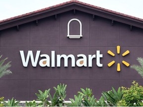 In this file photo a Walmart store logo is seen on the building of a Walmart Supercenter in Rosemead, California on May 23, 2019.