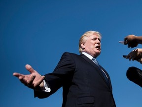 This file photo taken on September 24, 2017 shows US President Donald Trump speaking to the press while boarding Air Force One at Morristown Airport in Morristown, New Jersey.