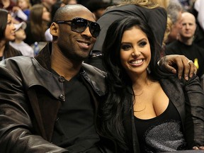 In this Feb. 13, 2010, file photo, Kobe Bryant of the Los Angeles Lakers smiles with his wife Vanessa Lynne during the Taco Bell Skills Challenge on All-Star Saturday Night, part of 2010 NBA All-Star Weekend at American Airlines Center in Dallas, Texas.