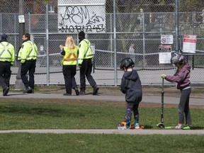 City bylaw enforcement officers in Trinity Bellwoods Park don't appear to be following the social distancing protocols they are there to enforce on Thursday, May 7, 2020.